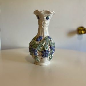 Vintage Ruffle mouth white pottery vase with grapevine design. No makers mark.